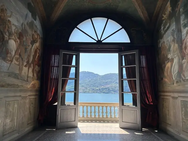 Tapestries in the Villa Carlotta, with a view of the lake.