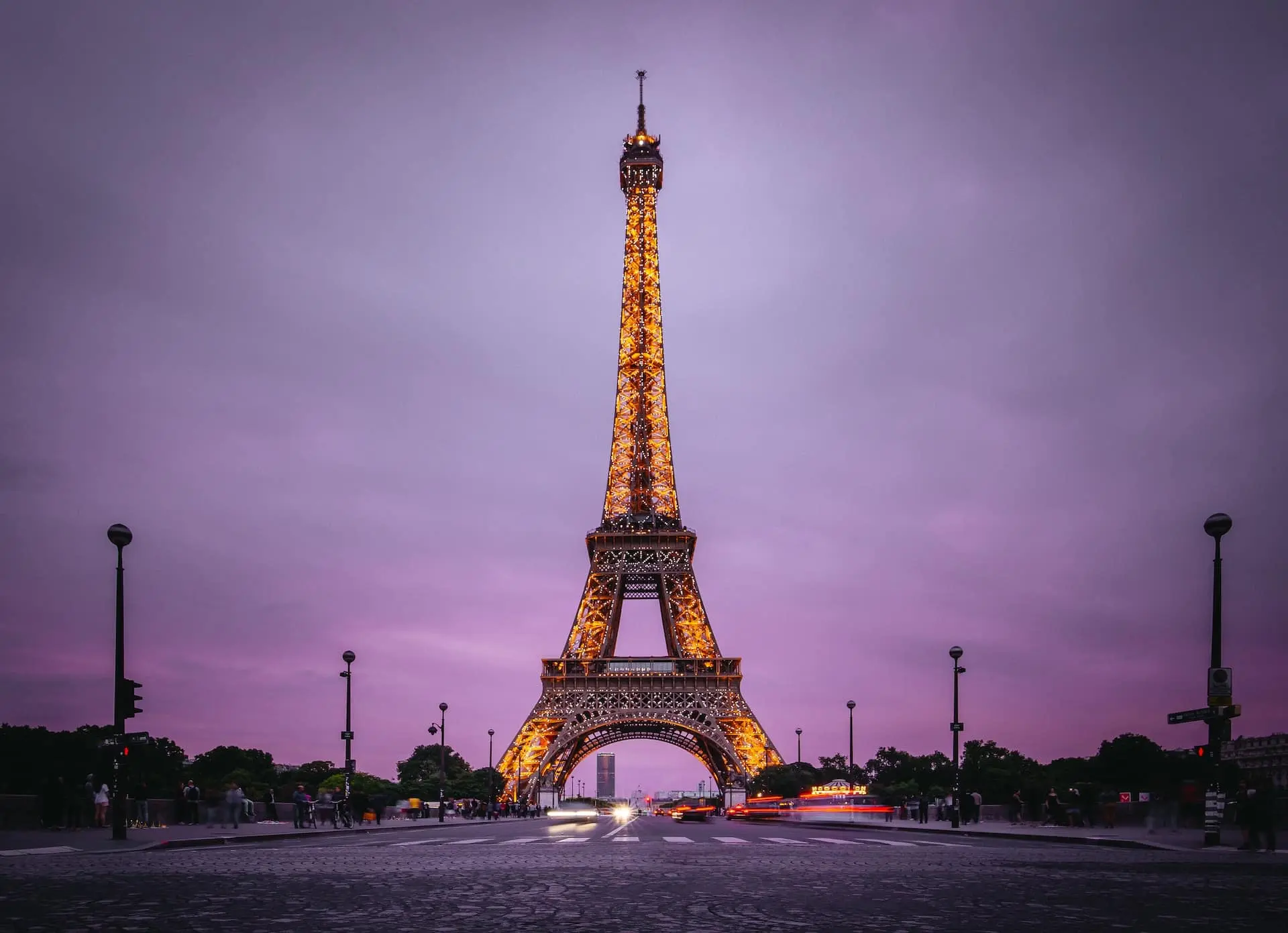 The Eiffel Tower illuminated at dusk.